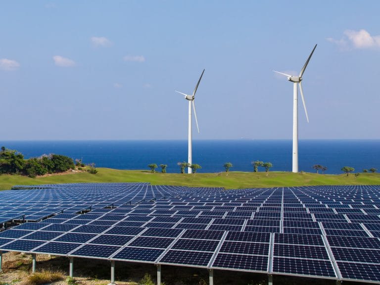 Windturbines and solar panels representing renewable energy